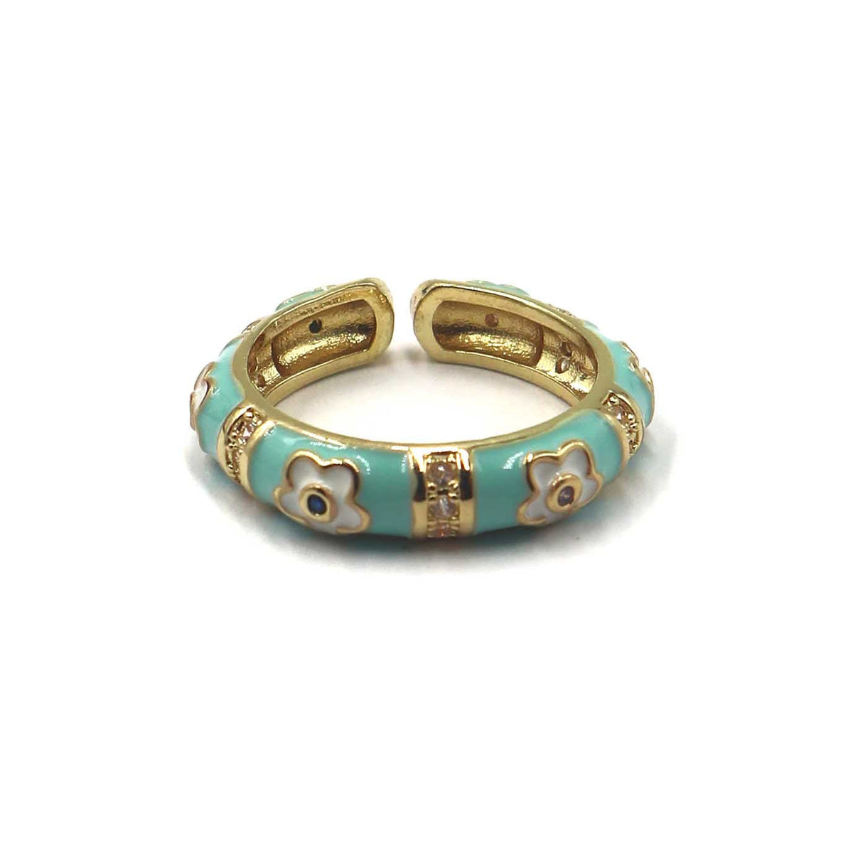 A gold-plated open cuff bangle bracelet with light turquoise enamel and white enamel floral motifs, shown on a plain white background.