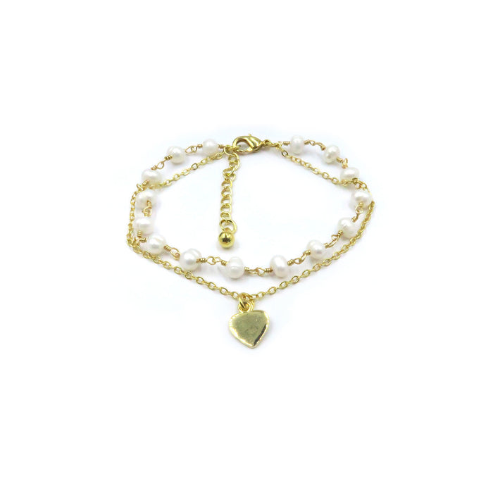 A double-strand gold chain bracelet featuring small white freshwater pearls and a polished gold heart-shaped charm, displayed on a clean white background with product code PEB0153-01.